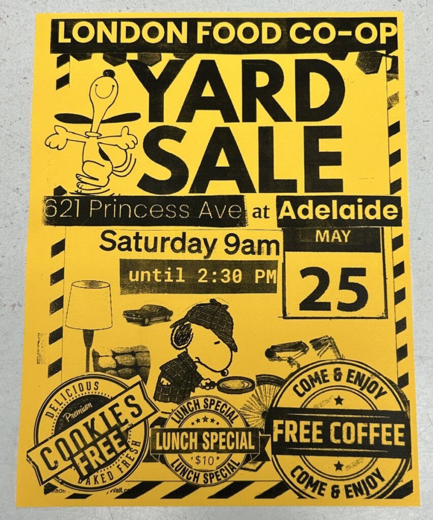 A yellow yard-sale sign for the London Food Co-op on May 25, between 9am and 2:30pm